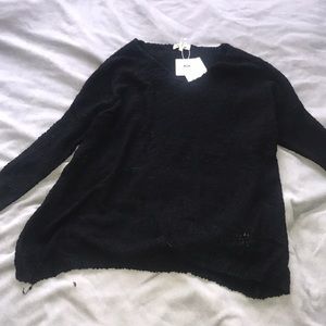Black V-neck sweater
